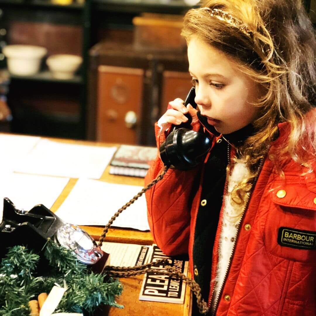 piper on the phone at middleport pottery museum