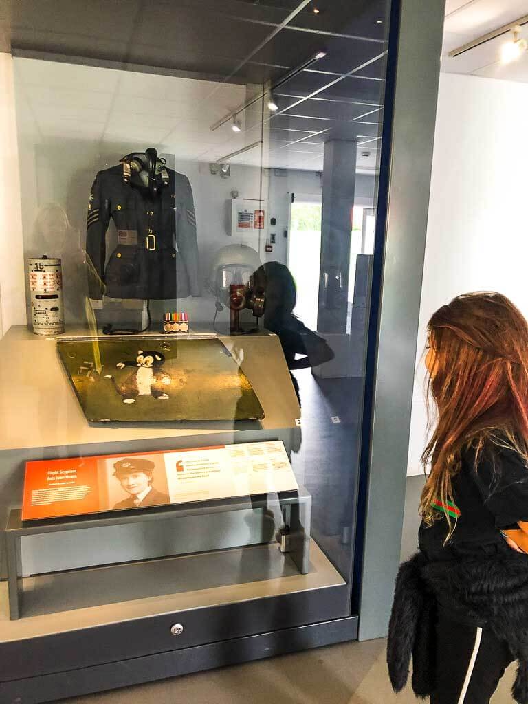 Girl Looking At Exhibit In Museum