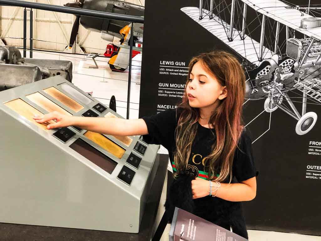 Piper Quinn Touching Different Materials Used To Build Aircraft