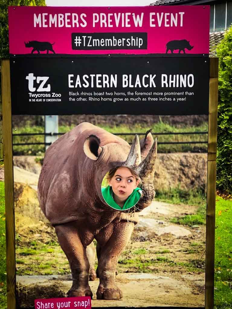 Girl Pulling Funny Face In Rhino Sign