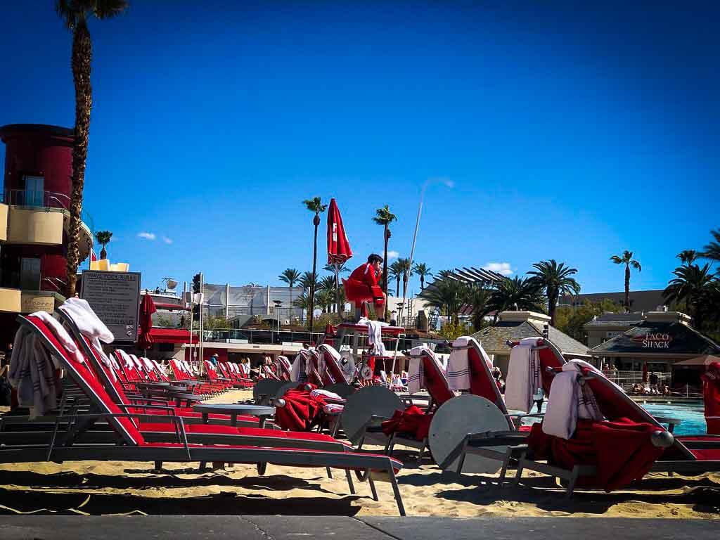 red sun loungers under a blue sky at the Mandalay bay hotel