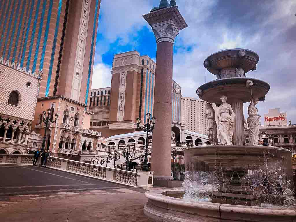 view of fountains and bridge outside the venetian hotel in las vegas