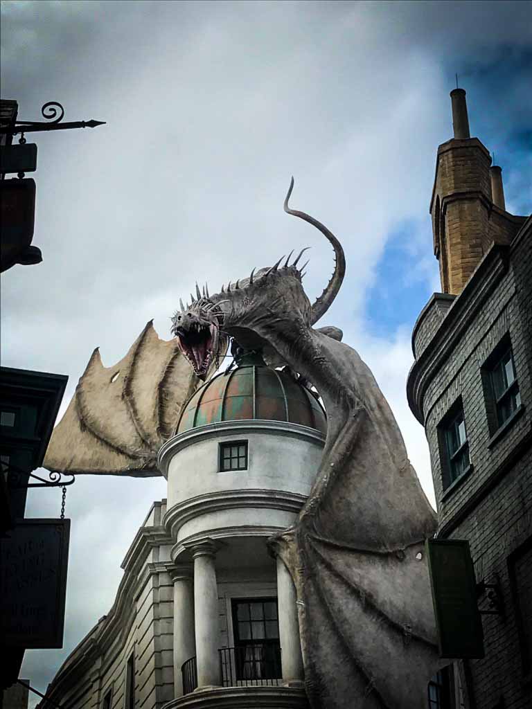 huge dragon on building at the wizarding world of harry potter