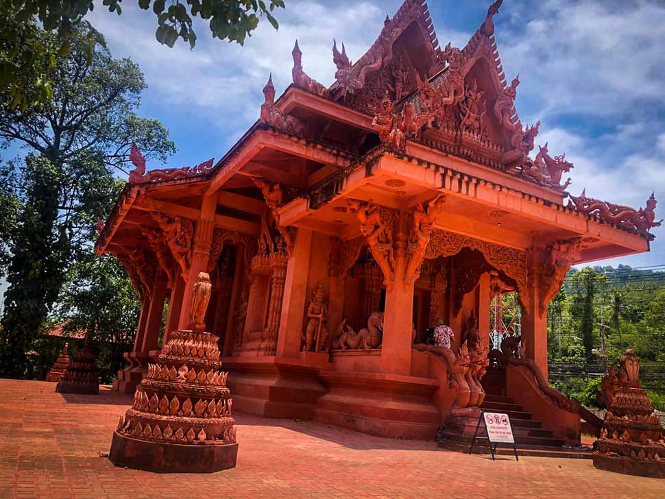 stunning bright red terracotta temple under a sunny sky