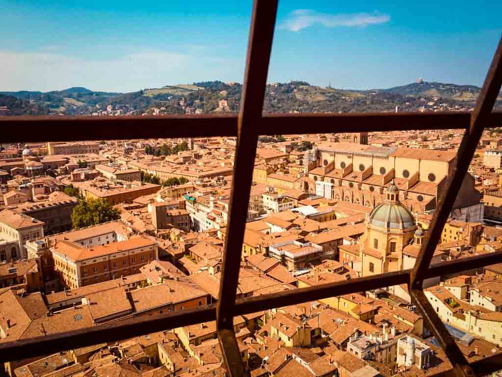 view of orange rooftops of bologna from above