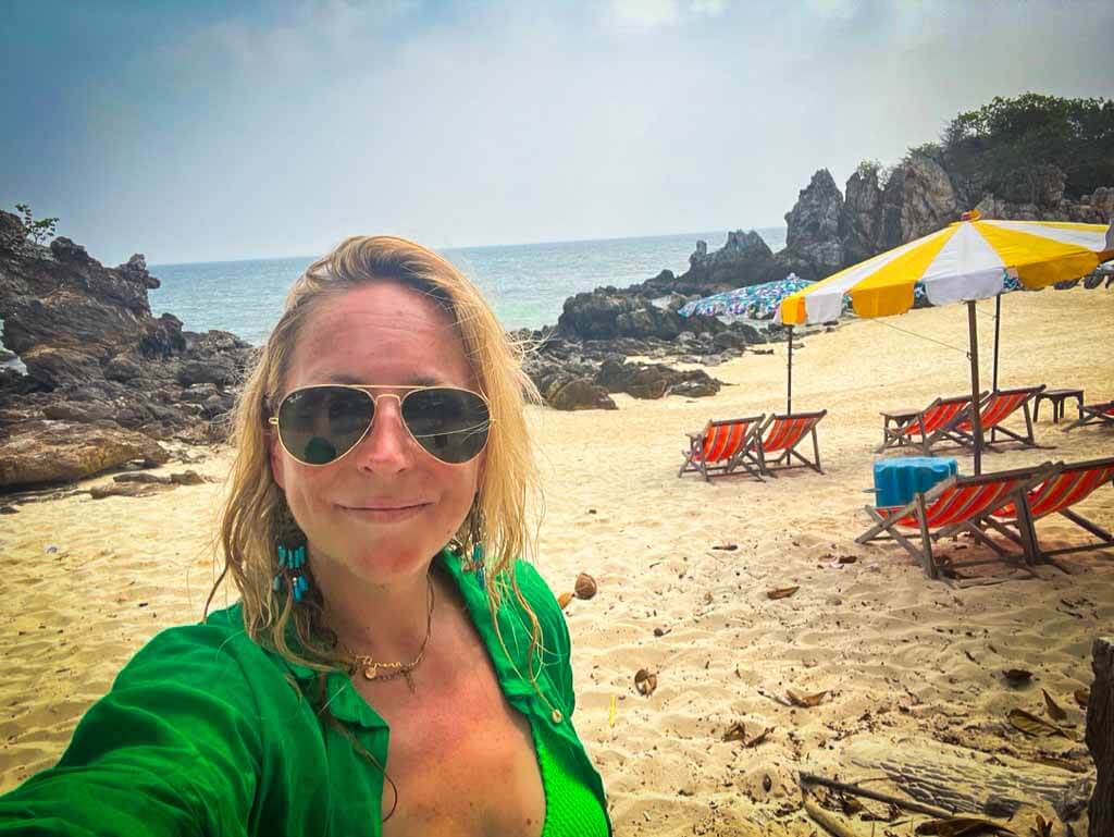 karen quinn wearing Ray ban aviators and a green shirt smiling at the camera on koh khai Nok