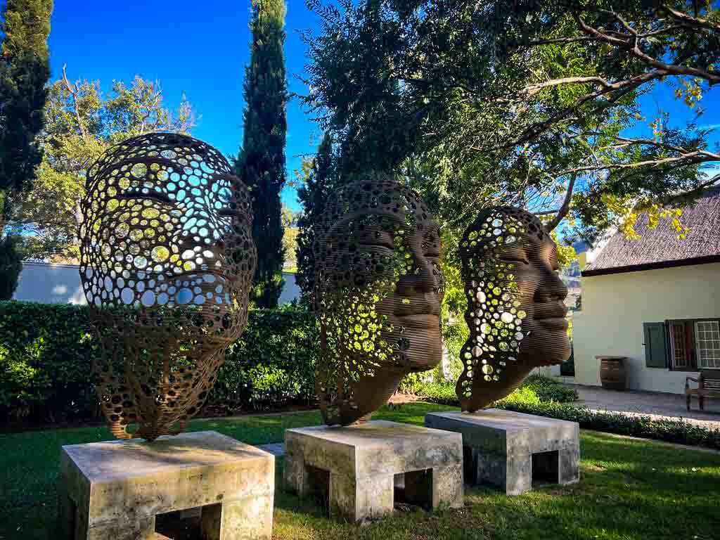 bronze metal face sculptures at Grand Provence winery