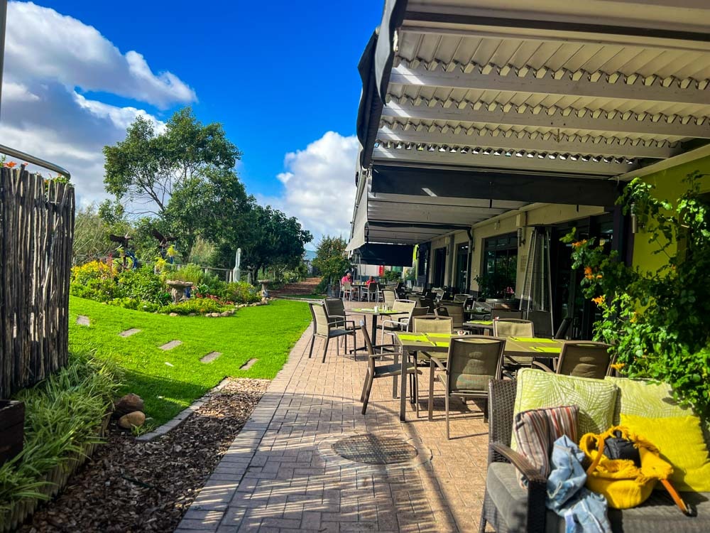 outdoor seating area on a sunny day at verde hotel near cape town airport