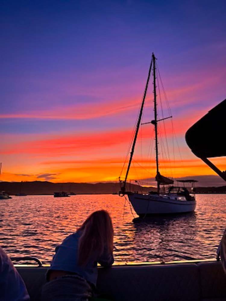 sunset sky with purple and orange colours above lagoon in knysna
