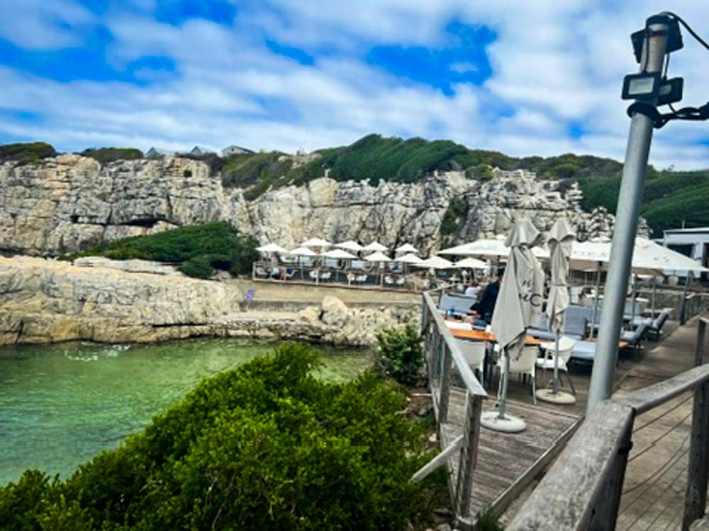 restaurant with outdoor seating nestled in the cliffs at hermanus